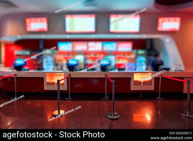 Blur of Defocus Background of People Waiting in Movie or Cinema Complex Lounge