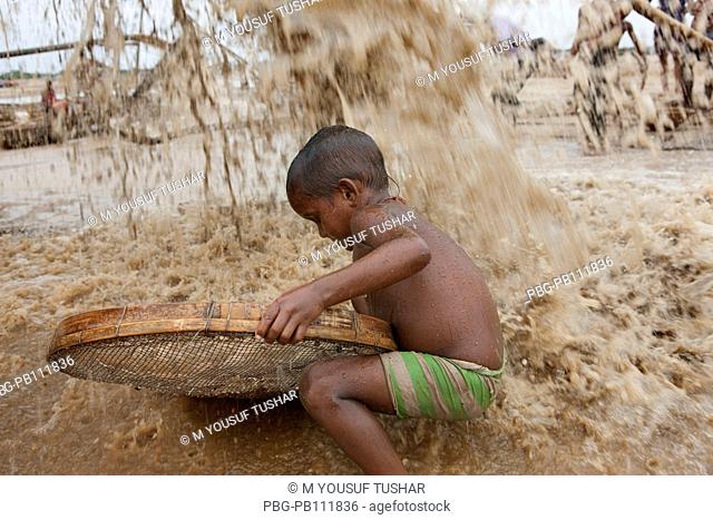 a child searching stone at Bholagonj Stone quarry field Bholagonj is located on the northeastern part of Bangladesh Bholagonj stone quarry field is one of the...