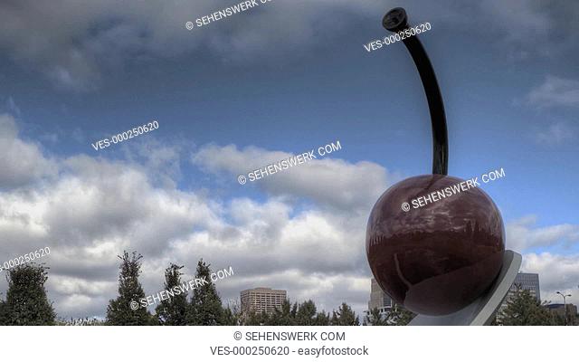 MINNEAPOLIS, USA October 19, 2011: HDR Timelapse of Spoonbridge and Cherry sculpture in Minneapolis. Designed by Claes Oldenburg and Coosje van Bruggen and it...