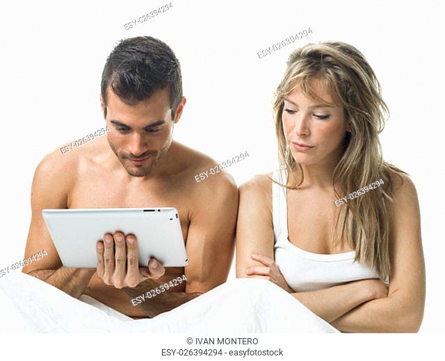 angry woman while his partner is watching a tablet