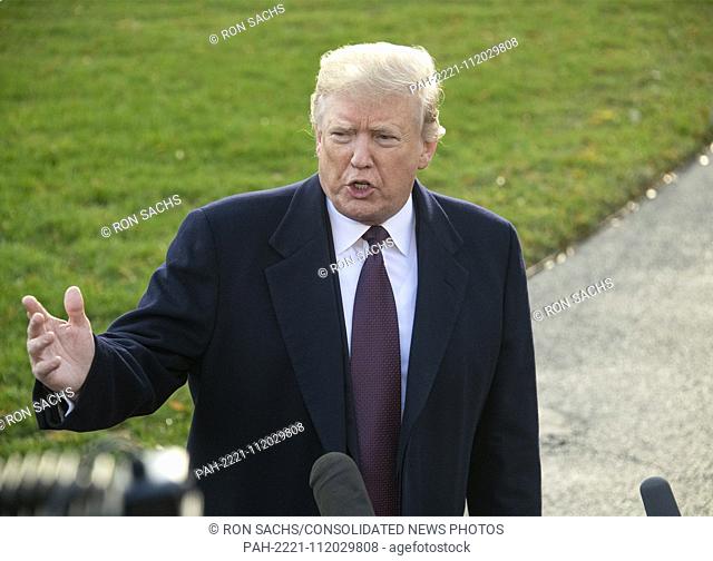 United States President Donald J. Trump takes questions from reporters as he prepares to depart from the South Lawn of the White House in Washington