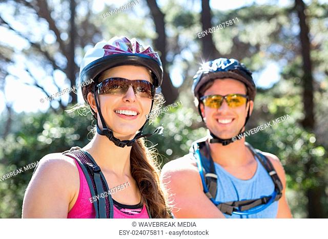 Portrait of smiling couple wearing helmets