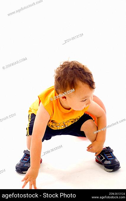 Active Baby Boy, Ready Position to Play Ball- Isolated over a white background