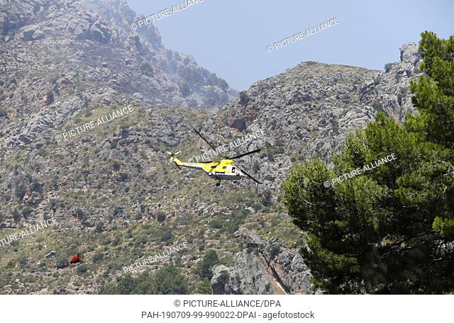 09 July 2019, Spain, Escorca: A fire in Cala Tuent, Serra de Tramuntana has burned some about 33 hectares of pine forest in Mallorca Its the first major fire...