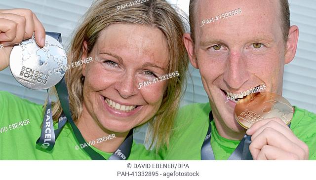 Silver medalist Angela Alexandra Maurer and Gold medalist Thomas Peter Lurz of Germany present their trophies after the men's and women's 25 km Marathon Open...