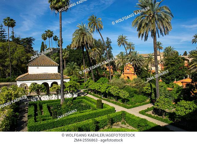 View of the gardens from the Galeria de Grutescos in the Alcazar, a royal palace, originally a Moorish fort in Seville, Andalusia, Spain