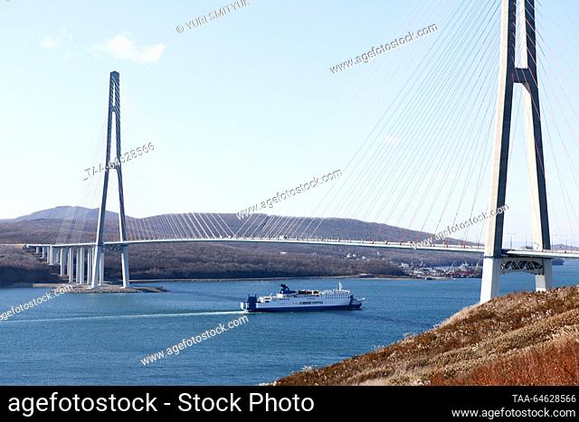 RUSSIA, VLADIVOSTOK - NOVEMBER 10, 2023: The Oriental Pearl VI ro-ro passenger ferry passes under Russky Bridge across the Eastern Bosphorus on her first trial...