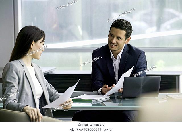 Business associates reviewing document