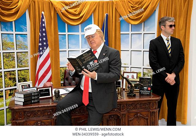 A 'President Trump' lookalike brings The Oval office to London's Waterloo Station to mark today's global release of James Patterson and Bill Clinton's...