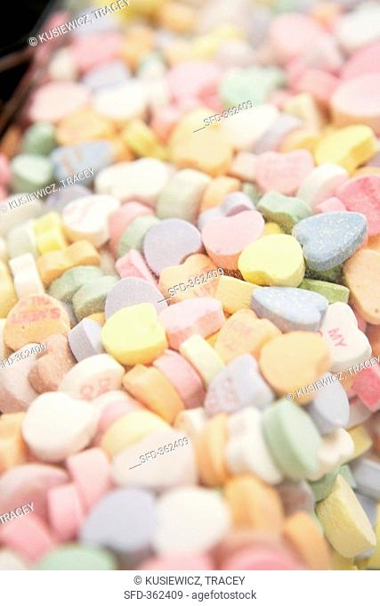 Mixed sugar hearts in a sweet dispenser