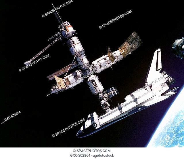 This view of the Space Shuttle Atlantis still connected to Russia's Mir Space Station was photographed by the Mir-19 crew on July 4, 1995