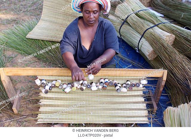 African Woman Weaving Mats  St Lucia Wetland Park, KwaZulu Natal Province, South Africa