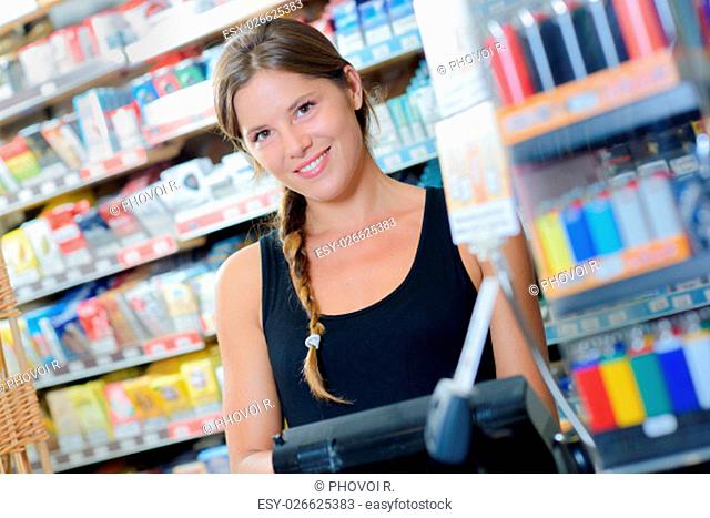 Female worker in a tobacconist