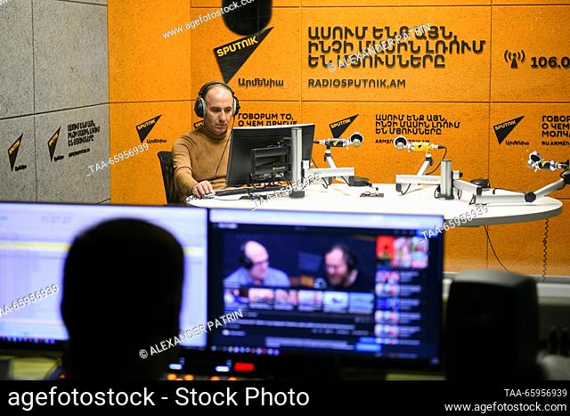 ARMENIA, YEREVAN - DECEMBER 21, 2023: Radio host Hovhannes Shoghikyan is seen at a studio of Sputnik Armenia. The Armenian Television and Radio Commission has...