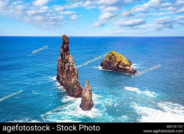 Aerial view of rock formation Ilheus da Rib and Ribeira da Janela in the rough ocean, Porto Moniz, Madeira island, Portugal, Atlantic, Europe