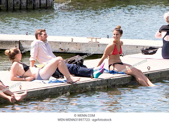 Office worshippers relax at Wapping docks in the sunshine. Featuring: Atmosphere Where: Wapping, United Kingdom When: 07 Jul 2017 Credit: WENN.com