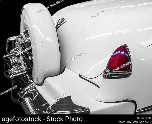 Oldtimer detail, Cadillac Series 62 1952, in black and white, with red brake light