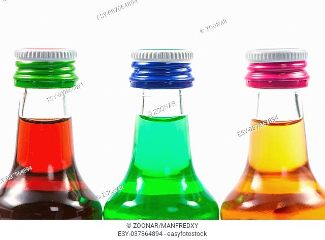 Various isolated liqueur bottles with party drinks