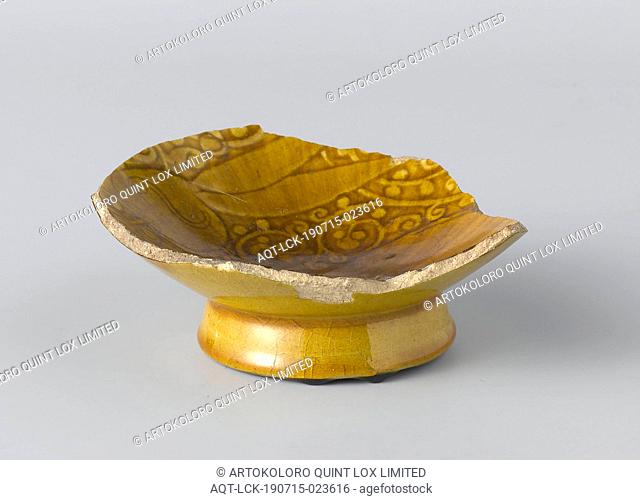 Fragment of a bowl with floral scrolls, Fragment of a bowl of quartz frit with incised floral vines on a transparent yellow lead-alkali glaze