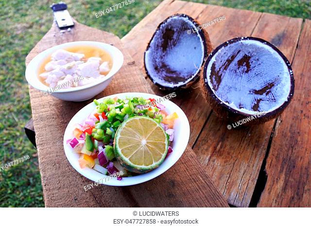 The tools and ingredients for making the Fijian Food, Kokoda (Raw Fish Salad). Kokoda is Fiji's version of ceviche, enriched with coconut milk to balance out...