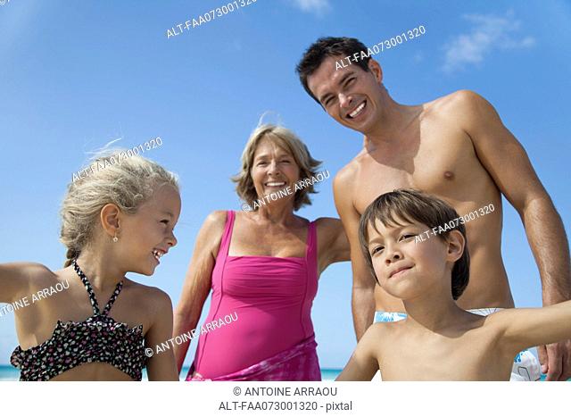 Multi-generation family having fun at the beach