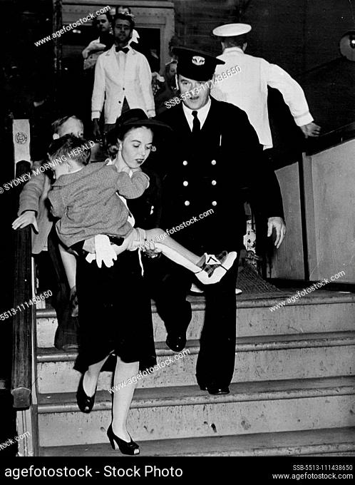 Children, Too, Suffer Wounds In Jap Attack -- A child, bearing the scars of war from then Japanese attack on Pearl Harbor is brought ashore at San Francsico at...