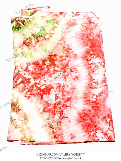 folded silk scarf with abstract pink and green pattern hand painted in nodular technique isolated on white background