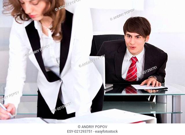 Businessman Staring At Woman's Back