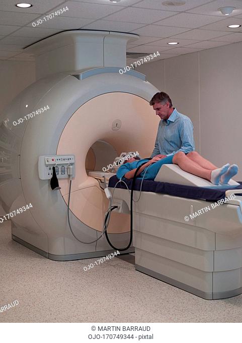 Technician and patient about to have MRI examination