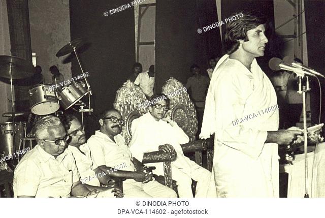 South Asian Indian Bollywood actor Amitabh Bachchan speaking at a function as Bal Thackeray looks on , India NO MR