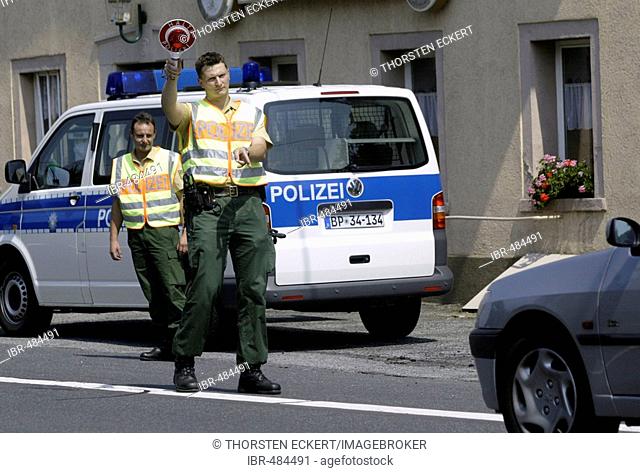 German police officers controlling cars near the czechian boarder, Saxony, Germany