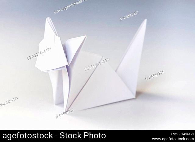 Paper cat origami isolated on a blank white background