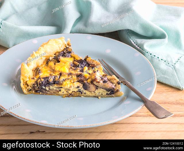 Mushroom and cheese quiche slice - Mushroom tart portion close up