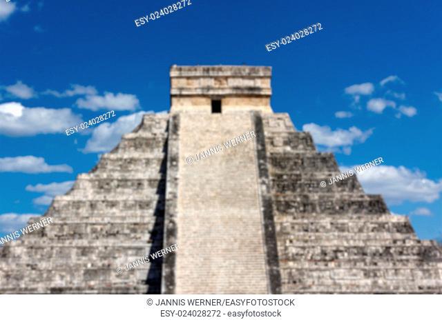 Blurred background of Mayan temple Pyramid at Chichen Itza, Yucatan, Mexico