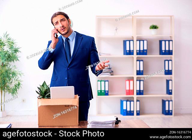 Young man being fired from his workplace