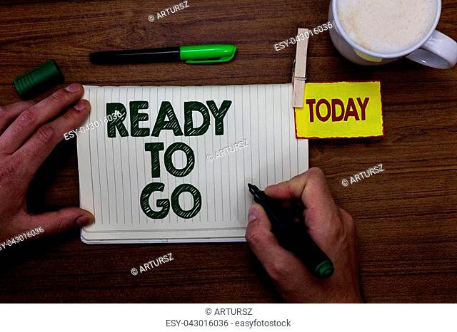 Word writing text Ready To Go. Business concept for Are you prepared for the future travel trip mission start Man holding marker notebook clothespin reminder...