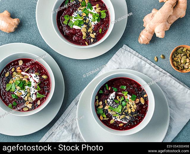 Ideas and recipes for healthy soup - Beetroot and ginger soup puree. Clean eating, detox, vegetarian diet concept. Top view of plate with perfect beet soup