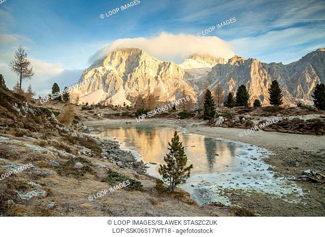 Frosty morning at the frozen lake of Limides in the Dolomites