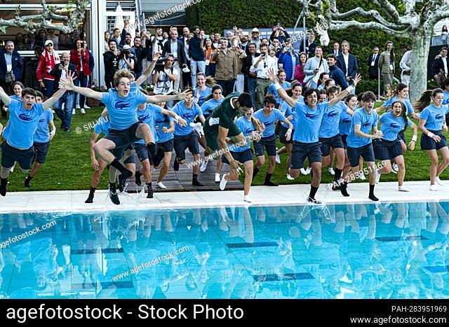 Carlos Alcaraz of Spain jump into the pool with the ballboys after winning the Barcelona Open Banc Sabadell tennis match at the Real Club de Tenis Barcelona on...