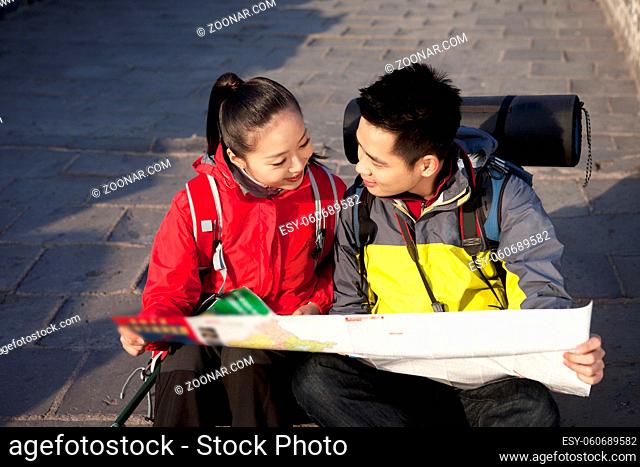 Young couples in the Great Wall tourism map high quality photo