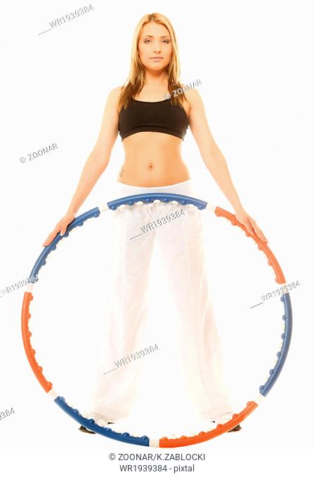 sporty fit girl doing exercise with hula hoop