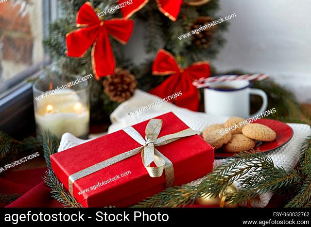 christmas gift in red wrapping with golden bow