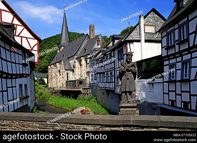 Half-timbered houses and parish church, Monreal at the Elz, Eifel, Rhineland-Palatinate, Germany