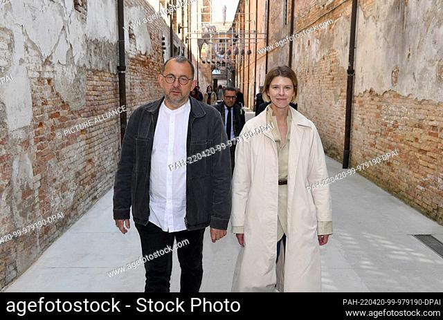 20 April 2022, Italy, Venedig: Ukrainian artist Pavlo Makov walks with curator Maria Lanko to a press conference at Teatro Piccolo in the Arsenale