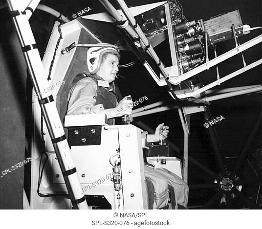 Female astronaut training  Jerrie Cobb born 1931 training  on  the MASTIF Multiple Axis Space Test Inertia Facility for the Mercury  Project     The MASTIF...