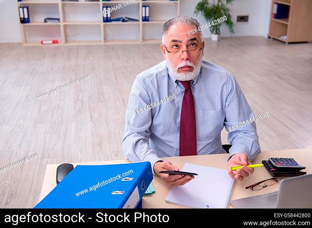 Senior accountant in budget planning concept in the office