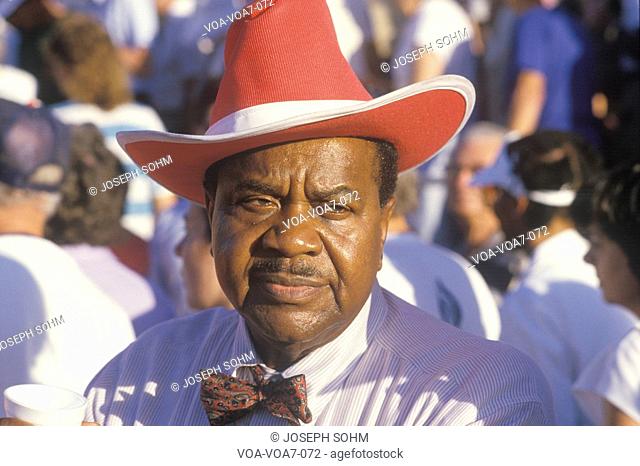 An African-American man at the U.S. Senior Olympics wearing a red cowboy hat, St. Louis, MO