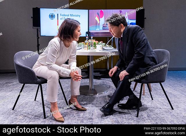 03 November 2022, North Rhine-Westphalia, Münster: Foreign Minister Annalena Baerbock (Greens), sits next to Yoshimasa Hayashi, Foreign Minister of Japan