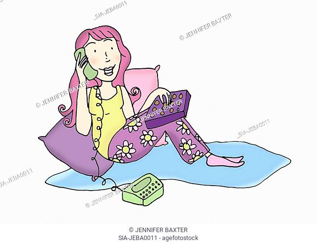 Pink haired woman leaning against cushions and speaking on phone