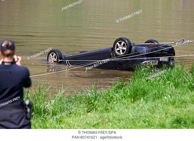 Forces of the police and fire brigade recovering a car from Mosel river near Ernst, Germany, 27 May 2016. The car was driven into the river past Tuesday